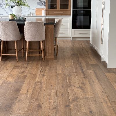 Professional hardwood-look flooring installation in modern Saskatoon kitchen